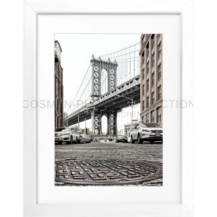 Manhattan Bridge in Brooklyn’s DUMBO area with a cobblestone street